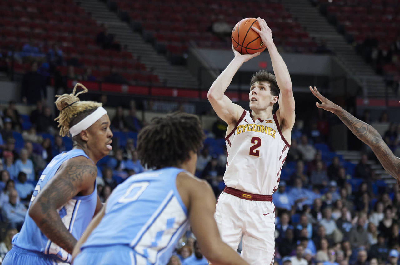Iowa State guard Caleb Grill (2) shoots over North Carolina forward Armando Bacot, left, and guard ...