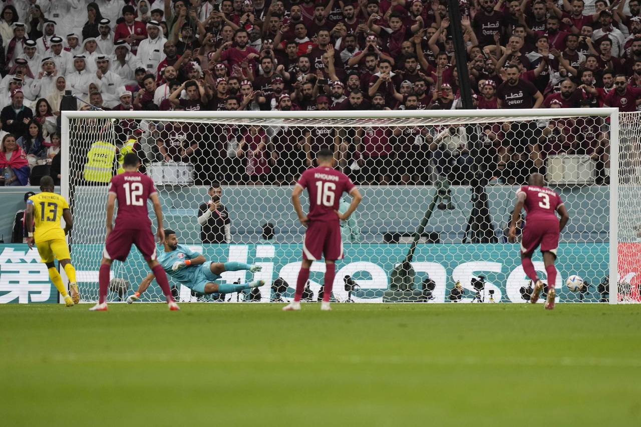 Ecuador's Enner Valencia scores his side's first goal on a penalty kick during the the World Cup gr...