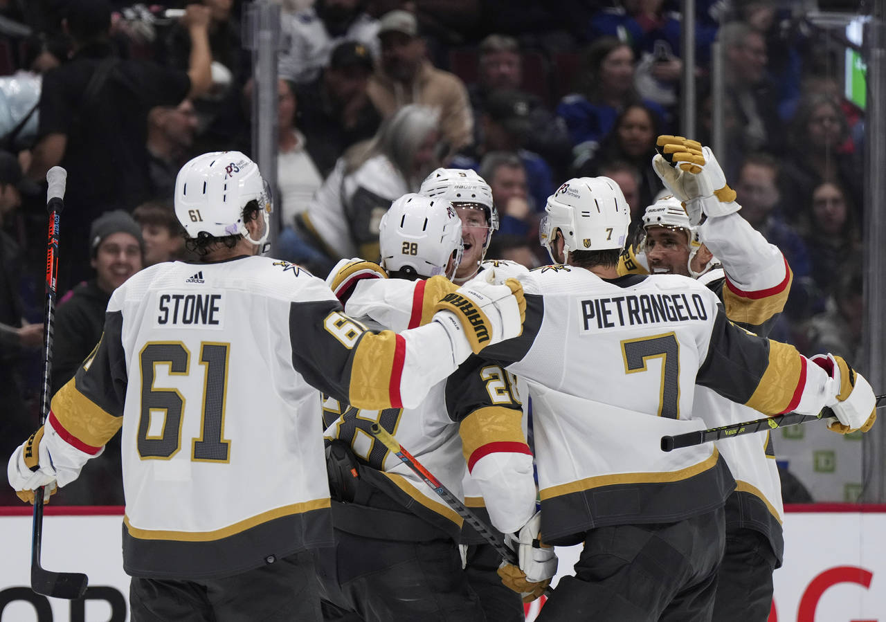 Vegas Golden Knights' Mark Stone, from left to right, William Carrier, Jack Eichel, Alex Pietrangel...