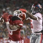 Arkansas rockets past No. 20 Ole Miss behind Sanders' 3 TDs