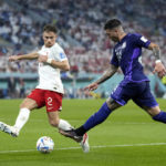 Messi and Argentina advance at World Cup, beat Poland 2-0
