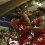 Black's 26 points carry No. 9 Arkansas past Louisville 80-54