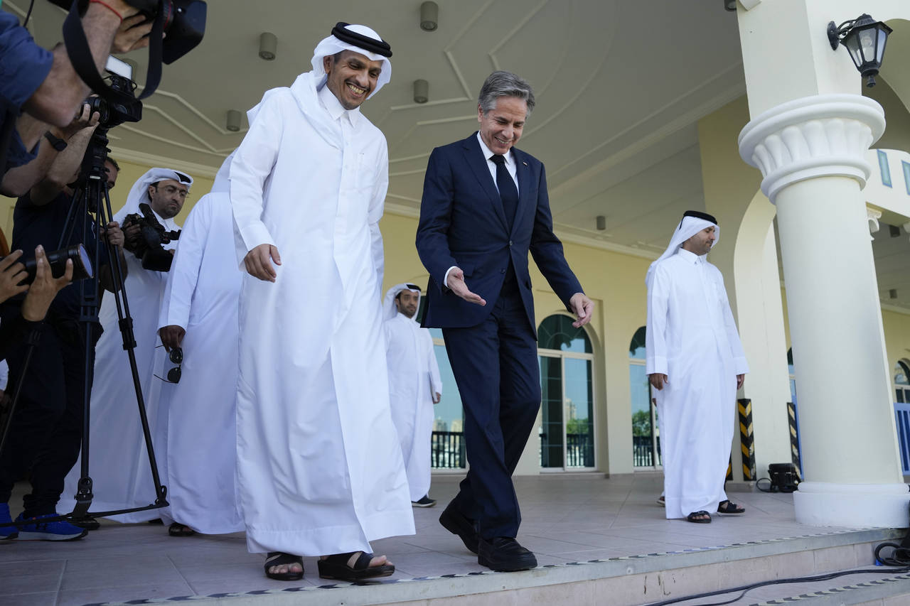 United States Secretary of State Antony Blinken, right, and Qatar Foreign Minister Mohammed Bin Adb...