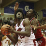 Black's 26 points carry No. 9 Arkansas past Louisville 80-54