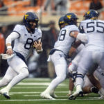Anderson's 2 long TD runs help W. Virginia top Oklahoma St.