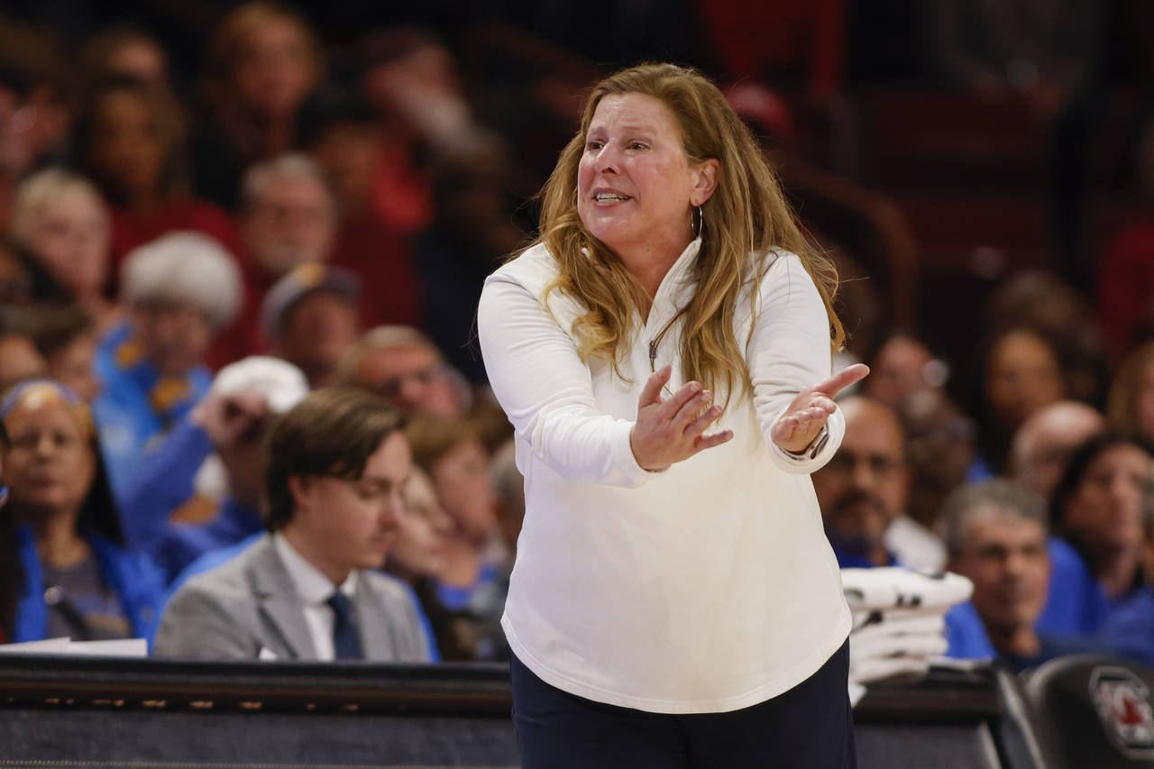 UCLA head coach Cori Close disputes an official's call during the second half of an NCAA college ba...