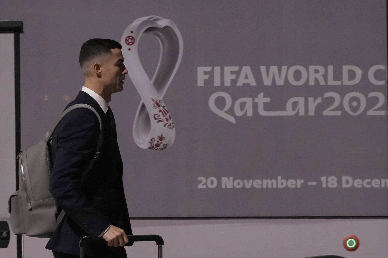 Cristiano Ronaldo of Portugal's national soccer team arrives at Hamad International airport in Doha...