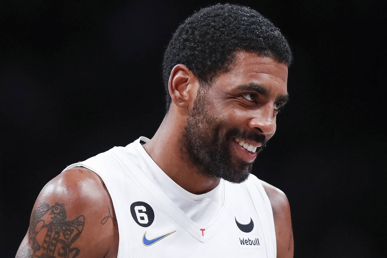 Brooklyn Nets guard Kyrie Irving reacts after scoring against the Memphis Grizzlies during the seco...