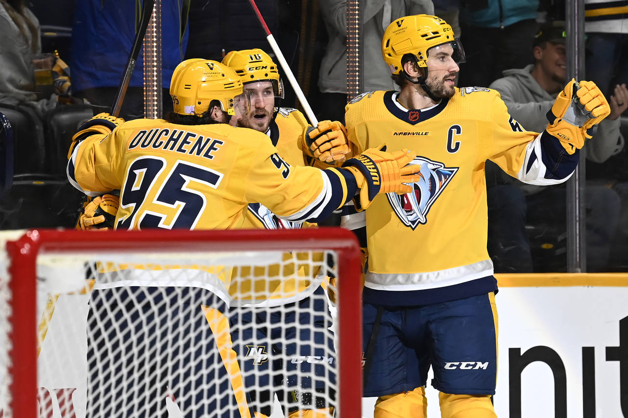 Nashville Predators center Colton Sissons (10) celebrates with Matt Duchene (95) and Roman Josi (59...