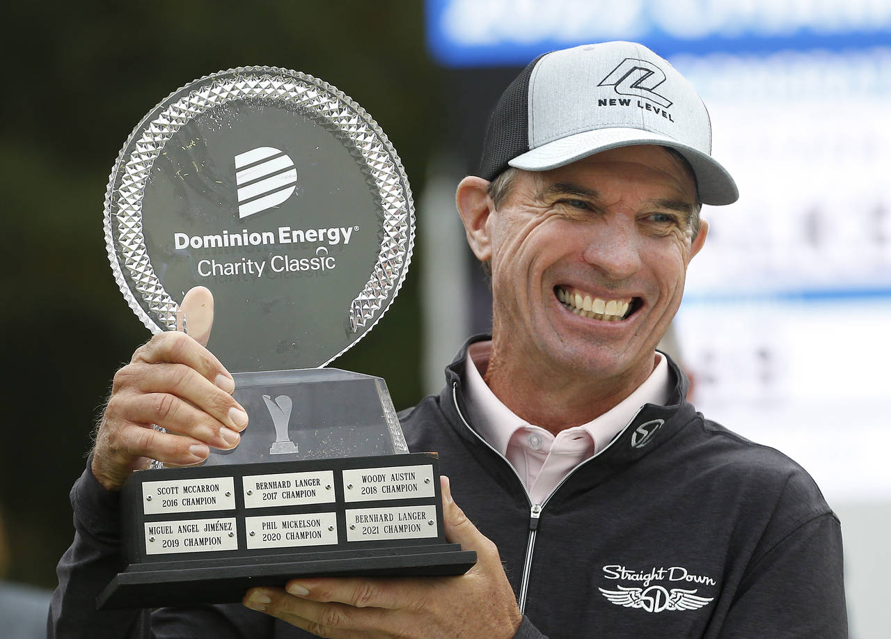 Steven Alker lifts the trophy after winning the Dominion Energy Charity Classic golf tournament at ...