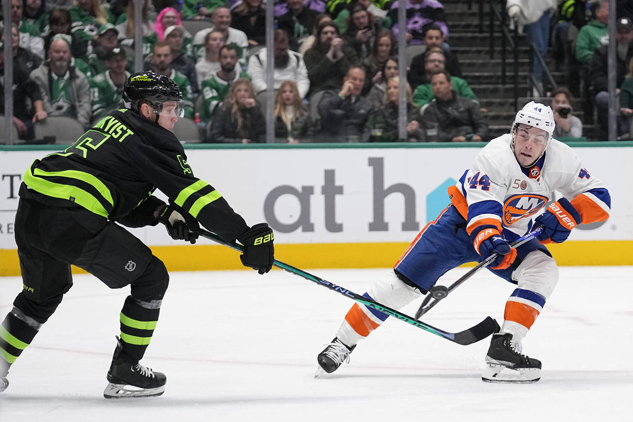Dallas Stars defenseman Nils Lundkvist (5) and New York Islanders center Jean-Gabriel Pageau (44) c...