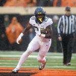 Anderson's 2 long TD runs help W. Virginia top Oklahoma St.