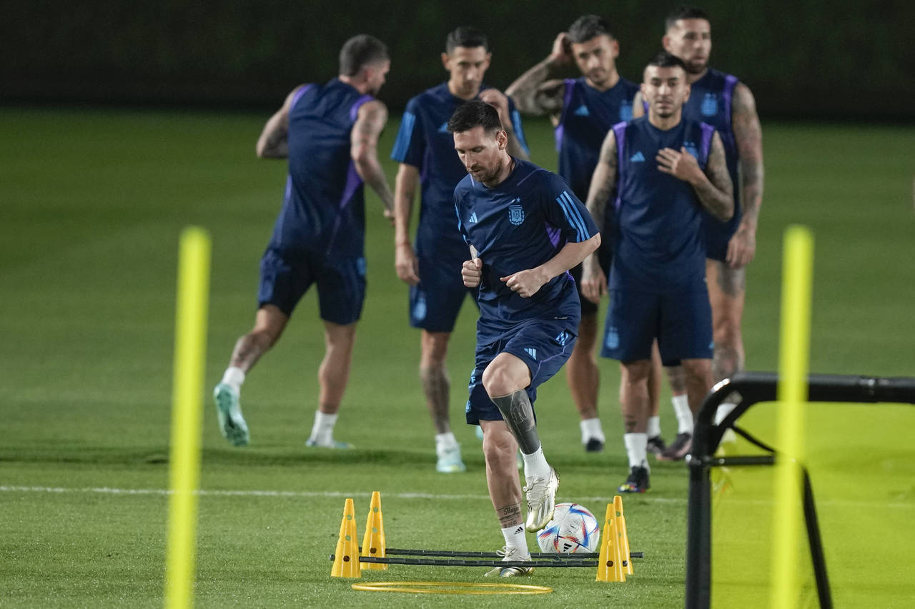 Lionel Messi warms up during Argentina official training on the eve of the group C World Cup soccer...