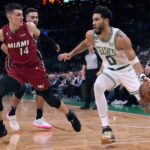 Tatum scores 49, Celtics hold off hot-shooting Heat 134-121