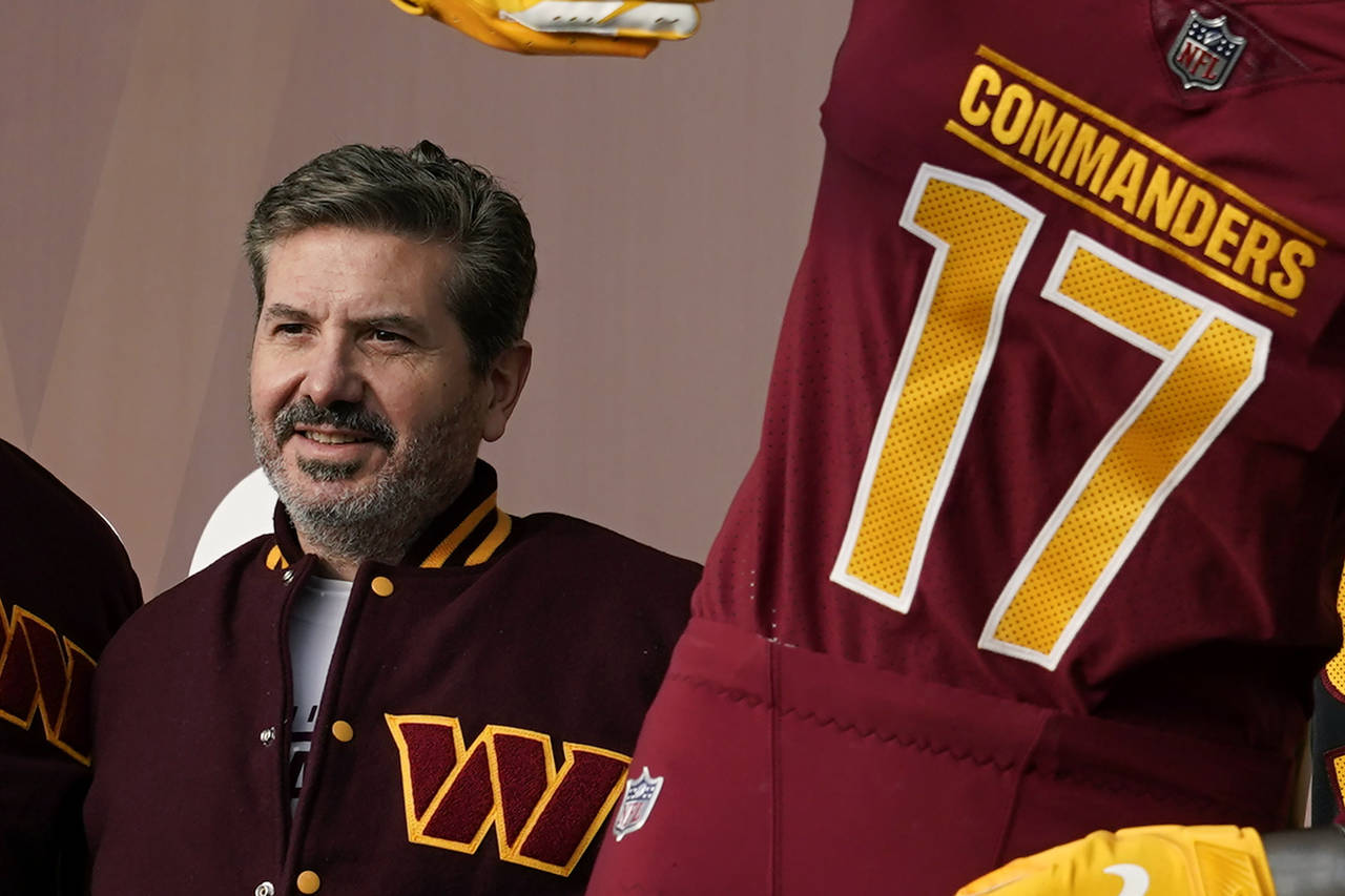 FILE - Washington Commanders' Dan Snyder poses for photos during an event to unveil the NFL footbal...