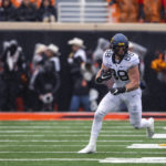 Anderson's 2 long TD runs help W. Virginia top Oklahoma St.