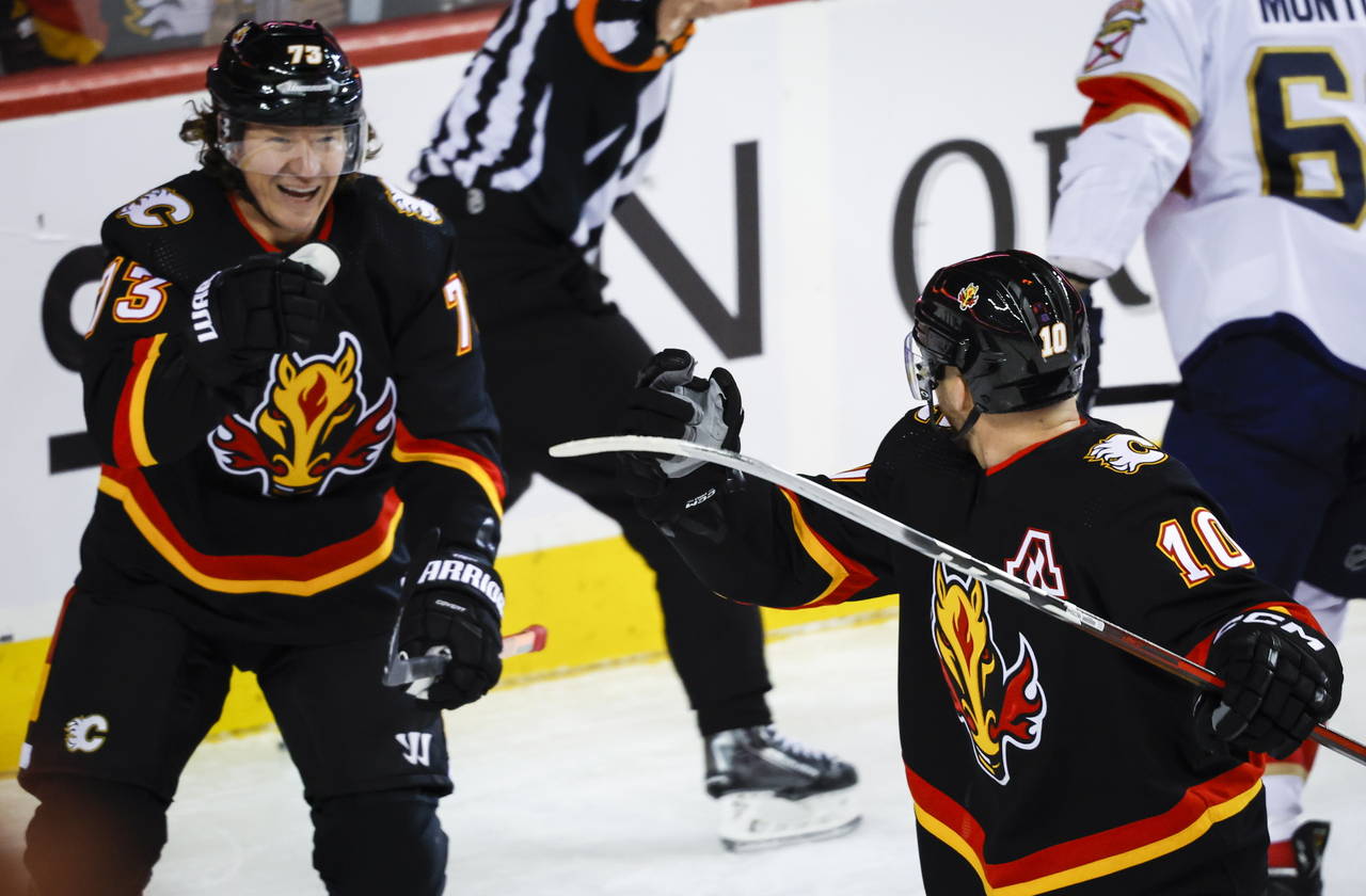Calgary Flames forward Jonathan Huberdeau, right, celebrates his goal against the Florida Panthers ...