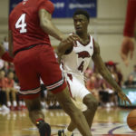 Black's 26 points carry No. 9 Arkansas past Louisville 80-54