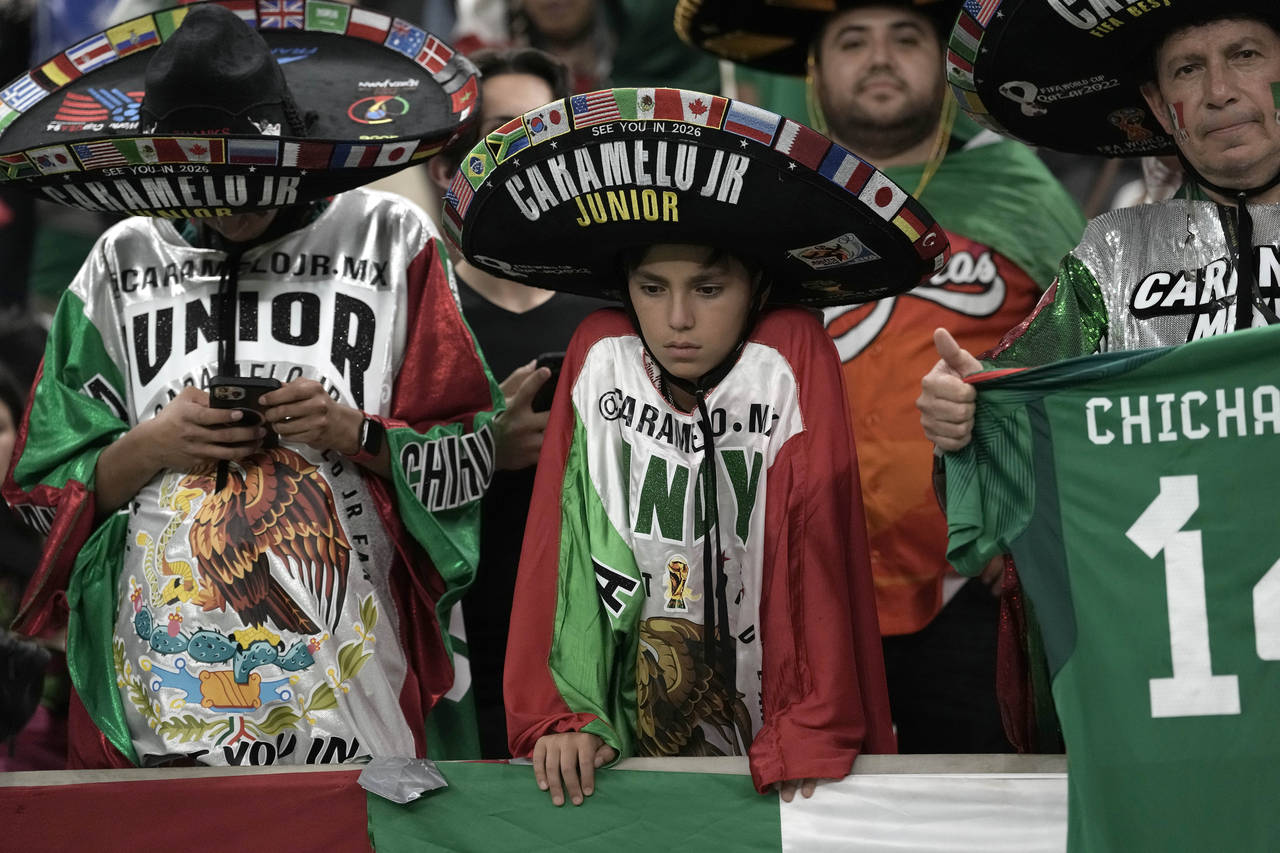 Mexico supporters react after the World Cup group C soccer match between Saudi Arabia and Mexico, a...