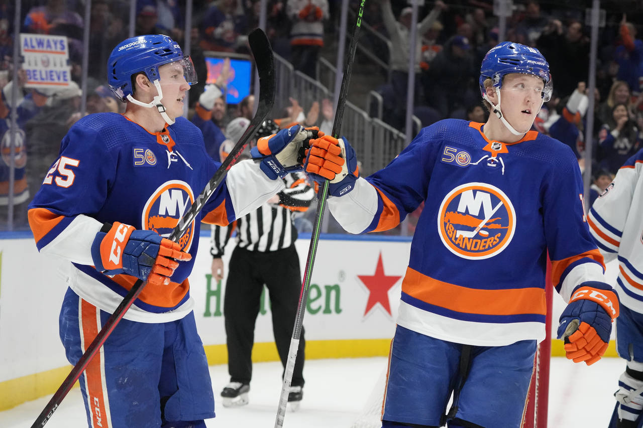 New York Islanders defenseman Sebastian Aho (25) celebrates his goal on Edmonton Oilers goaltender ...