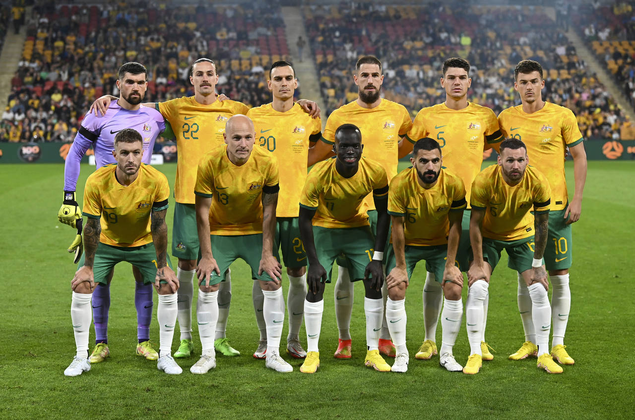 FILE - The Australian national soccer team, the Socceroos, pose for a photo before the start of a f...
