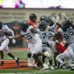 Anderson's 2 long TD runs help W. Virginia top Oklahoma St.