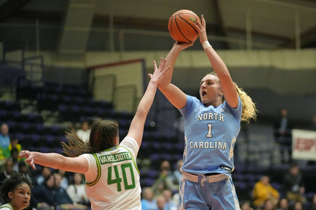 North Carolina guard Alyssa Ustby (1) shoots as Oregon forward Grace VanSlooten (40) defends during...