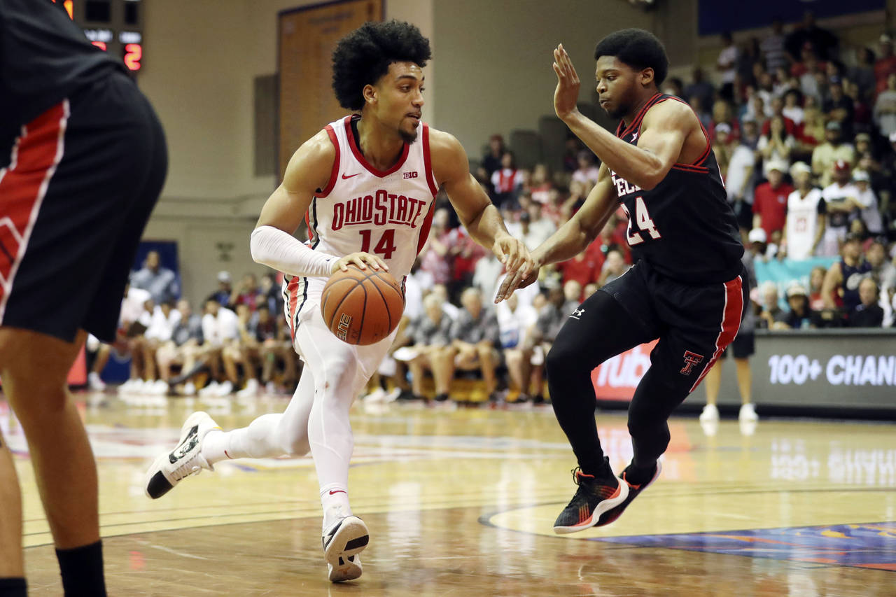 Texas Tech guard Kerwin Walton (24) tries to guard Ohio State forward Justice Sueing (14) during th...