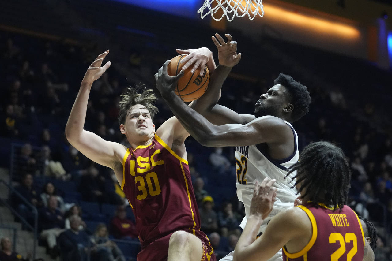 Southern California forward Harrison Hornery (30) and California forward ND Okafor (22) compete for...