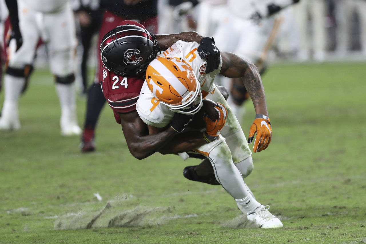 South Carolina defensive back Marcellas Dial Jr. (24) tackles Tennessee wide receiver Cedric Tillma...