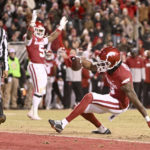 Arkansas rockets past No. 20 Ole Miss behind Sanders' 3 TDs