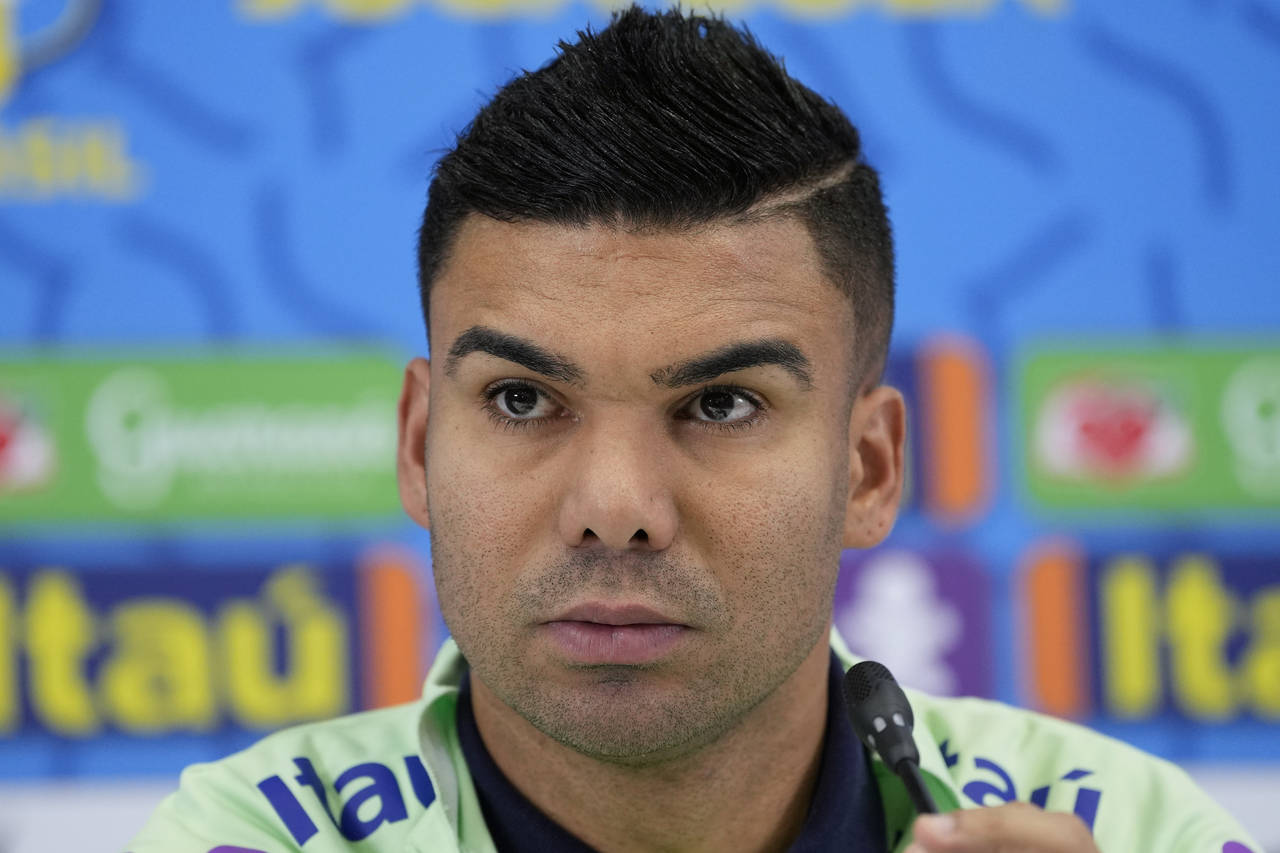 Brazil's Casemiro listens to a question during a press conference after a training session at the G...