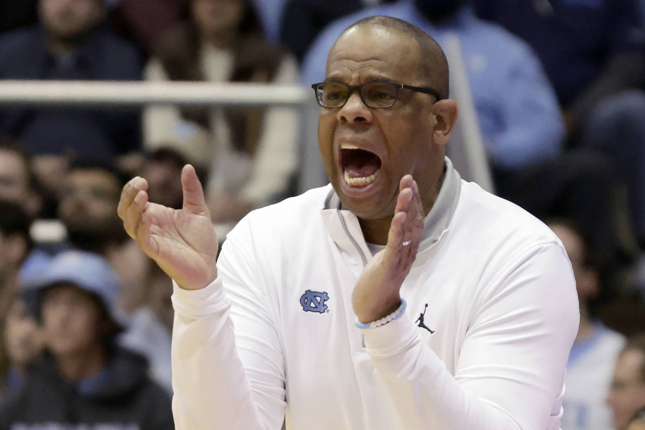 North Carolina head coach Hubert Davis cheers on his team during the second half of an NCAA college...