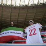 Iran government supporters confront protesters at World Cup