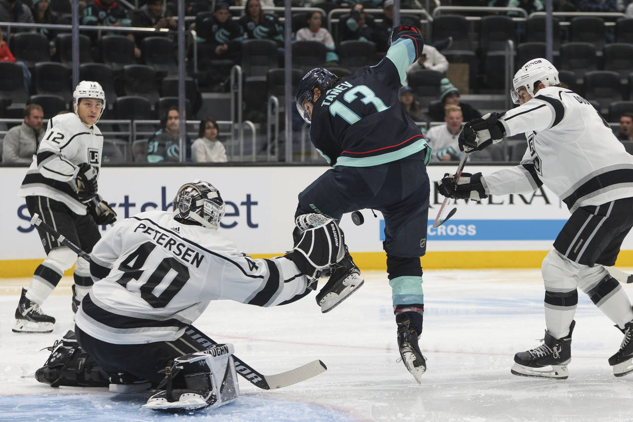 Los Angeles Kings goaltender Cal Petersen goes to make a save as Seattle Kraken left wing Brandon T...