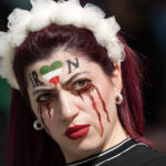 Iran regime supporters confront protesters at World Cup game