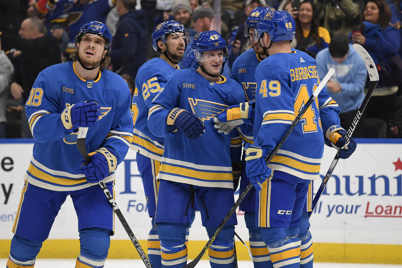 St. Louis Blues' Torey Krug (47) celebrates with teammates after scoring a goal against the Anaheim...