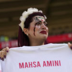 Iran government supporters confront protesters at World Cup