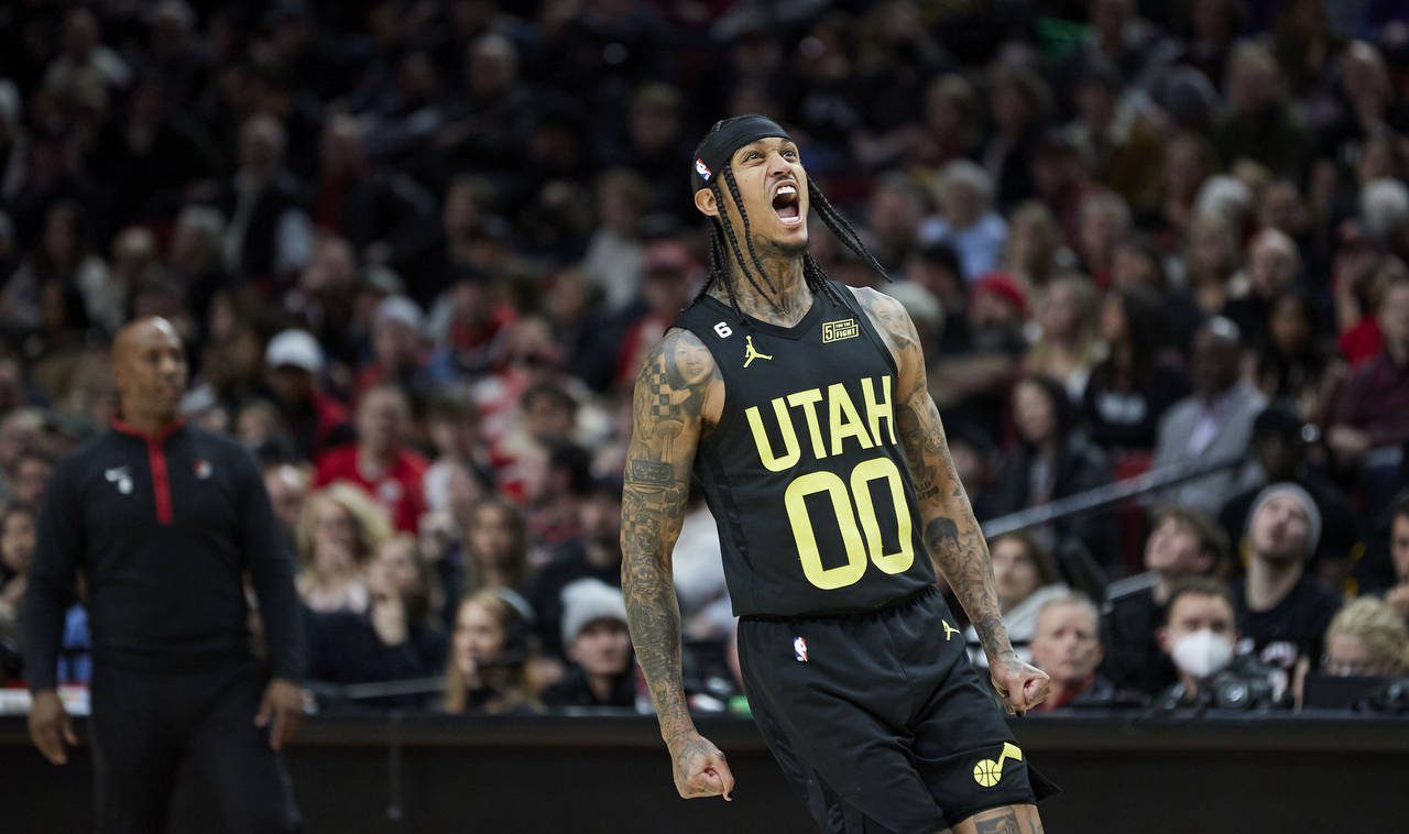 Utah Jazz guard Jordan Clarkson reacts after scoring to give the team the lead against the Portland...