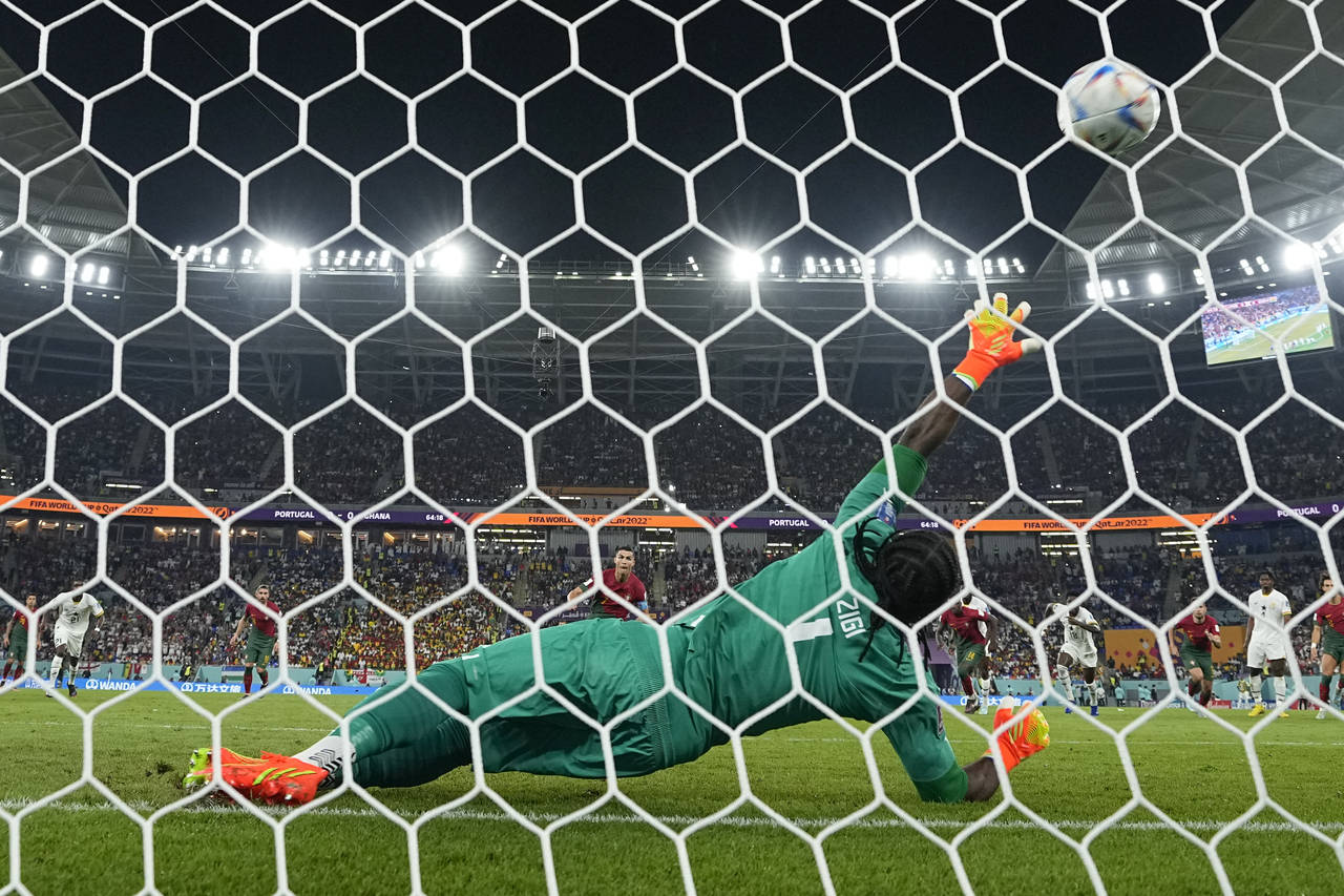 Portugal's Cristiano Ronaldo scores his side's opening goal on a penalty during the World Cup group...