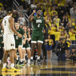 Dickinson, No. 20 Michigan shuck Ohio's late shot, win in OT