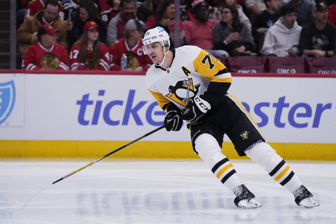 Pittsburgh Penguins center Evgeni Malkin skates during the first period of an NHL hockey game again...