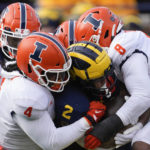 No. 3 Michigan beats Illinois 19-17 after Corum hurts knee