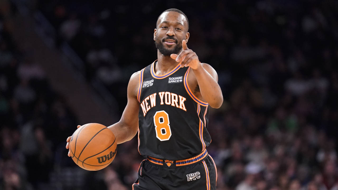 FILE - New York Knicks guard Kemba Walker (8) dribbles up the court during the second half of an NB...