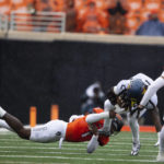 Anderson's 2 long TD runs help W. Virginia top Oklahoma St.