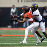 Anderson's 2 long TD runs help W. Virginia top Oklahoma St.