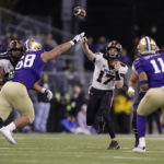 
              Oregon State quarterback Ben Gulbranson (17) throws a pass under pressure from Washington defensive lineman Ulumoo Ale (68) during the first half of an NCAA college football game Friday, Nov. 4, 2022, in Seattle. (AP Photo/John Froschauer)
            