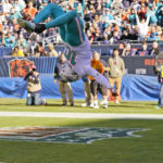 Tua, Dolphins outlast Bears on Fields' record rushing day
