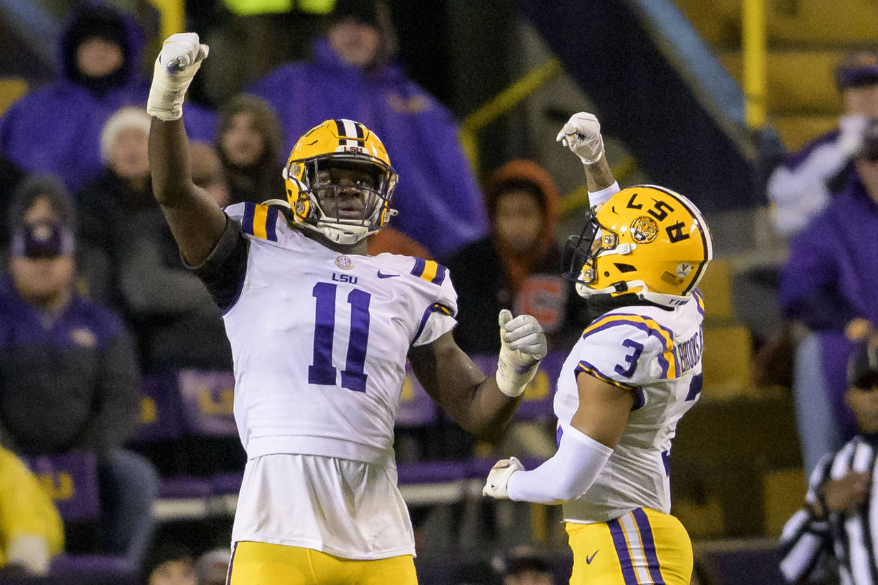 LSU defensive end Ali Gaye (11) celebrates a sack of UAB quarterback Dylan Hopkins with safety Greg...