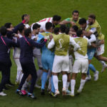 Iran government supporters confront protesters at World Cup